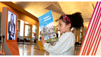 A child browses an activity book in the parliament