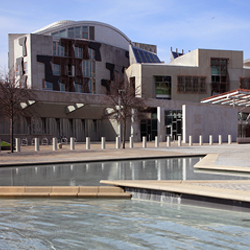 Scottish Parliament building with ponds in foreground