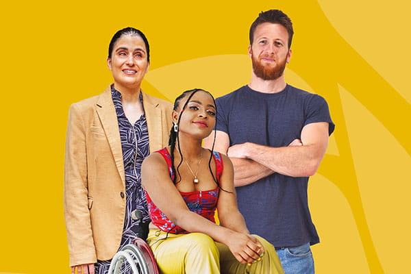 A woman with a visual impairment, a younger woman in a wheelchair, and a man standing with his arms folded, against a yellow background