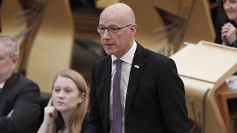 John Swinney MSP answering a question in the Debating Chamber