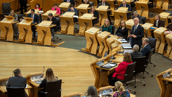 First Minister John Swinney speaking during First Minister's Questions on 16 May 2024