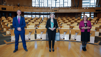 Presiding Officer Alison Johnstone with Deputy Presiding Officers Liam McArthur and Annabelle Ewing on the floor of the Debating Chamber