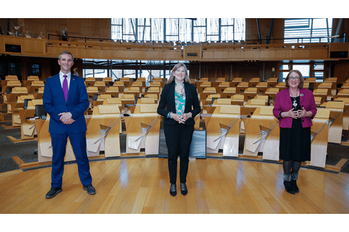 Presiding Officer Alison Johnstone with Deputy Presiding Officers Liam McArthur and Annabelle Ewing on the floor of the Debating Chamber