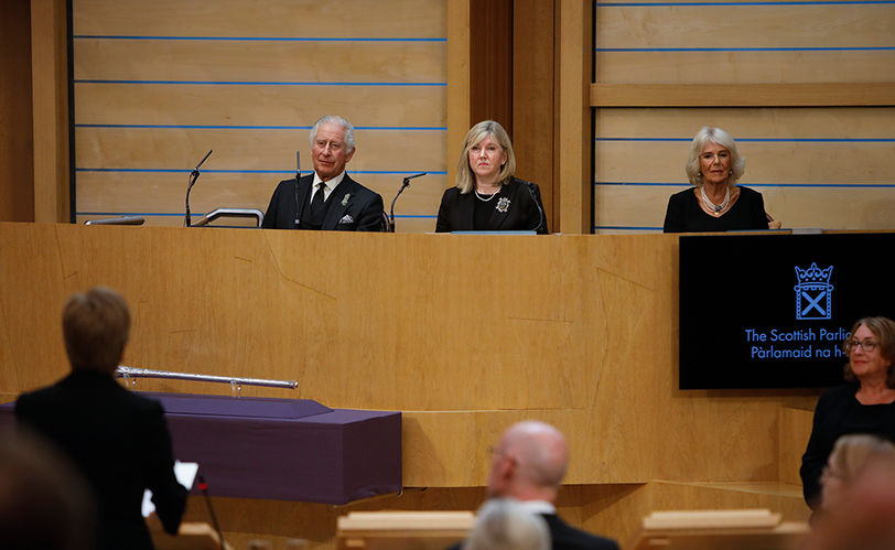 King Charles III, the Presiding Officer Alison Johnstone MSP, and the Queen Consort listen to First Minister Nicola Sturgeon MSP during the Motion of Condolence