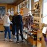 visitors looking at souvenirs in a gift shop