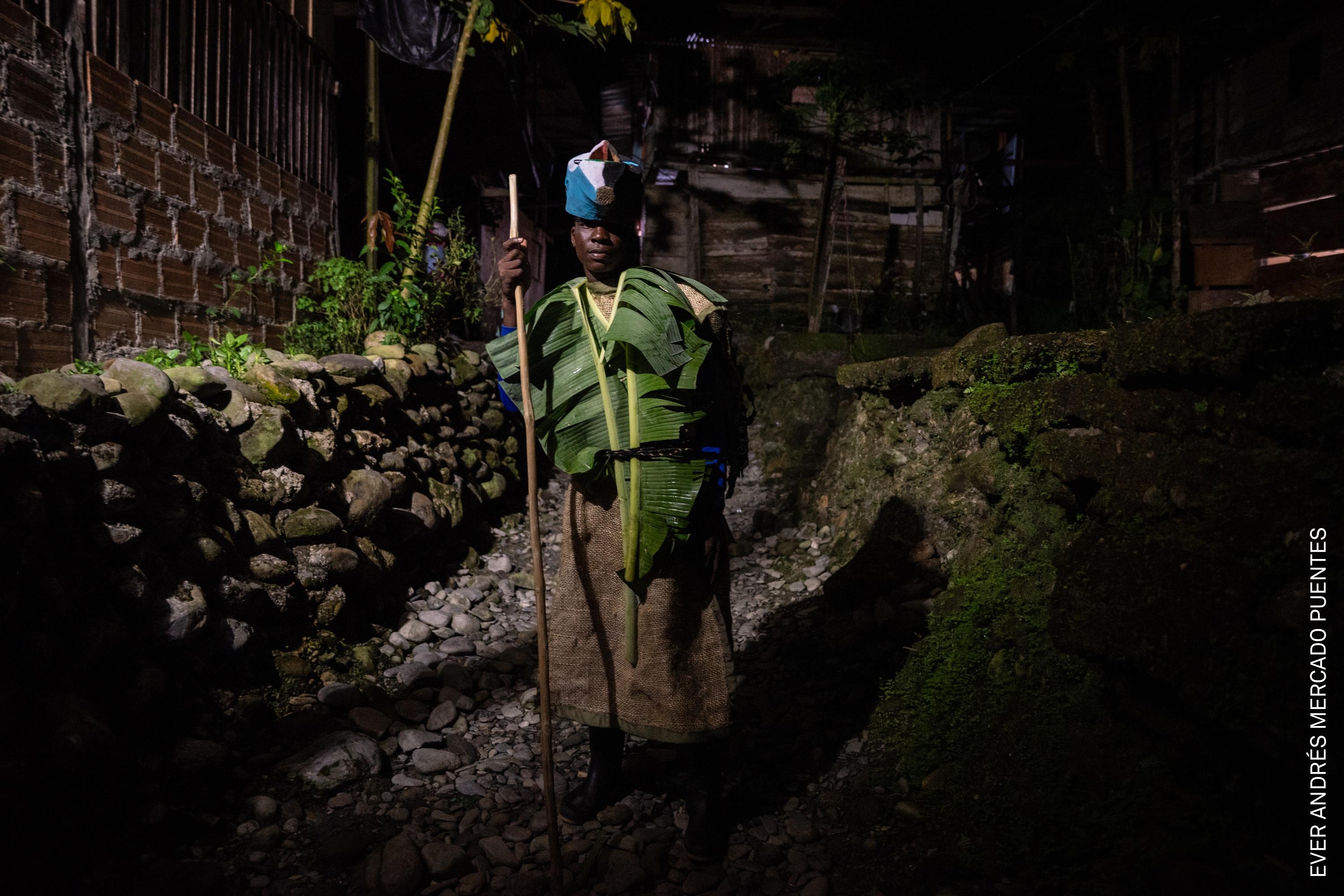 Eider Calimeño is one of 33 men who act as Matachín: those who commit to participating in the Fiesta de los Manacillos. This ancestral responsibility is passed down through male lineage, requiring participants to return to Juntas every Holy Week to preserve their heritage. Juntas, Buenaventura, Colombia.