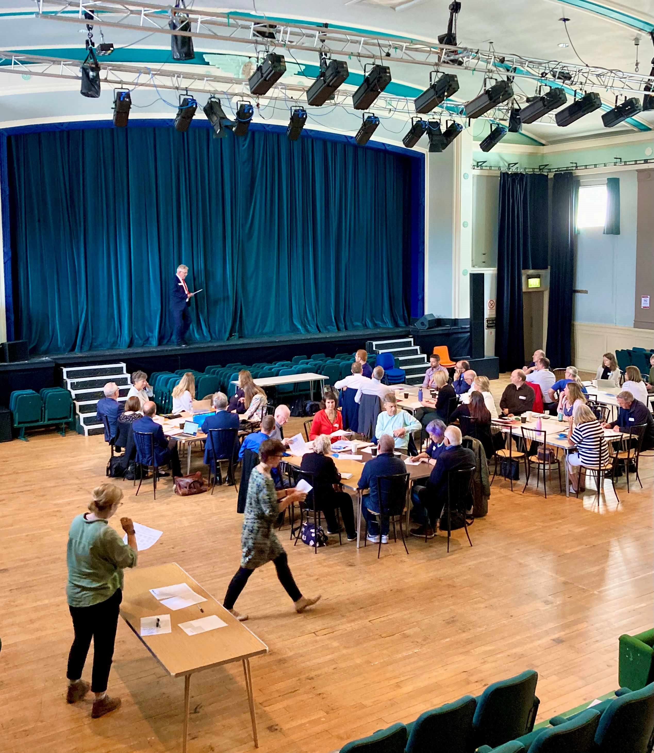 A picture from the Committee's engagement event, showing Committee Members and participants engaged in discussion.